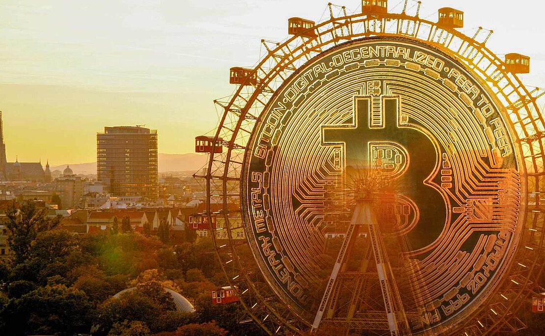 Prater mit Riesenrad, die Mitte des Riesenrades ist mit einer Bitcoin-Münze ausgefüllt