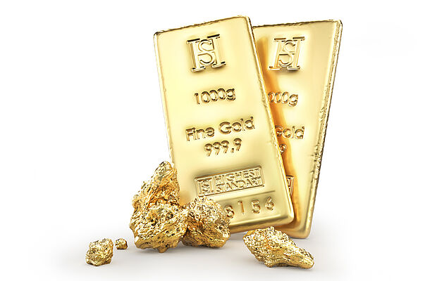 Zwei Goldbarren und ein paar Gold-Nuggets